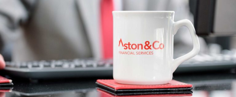 White mug with logo of Aston and Co Financial Services